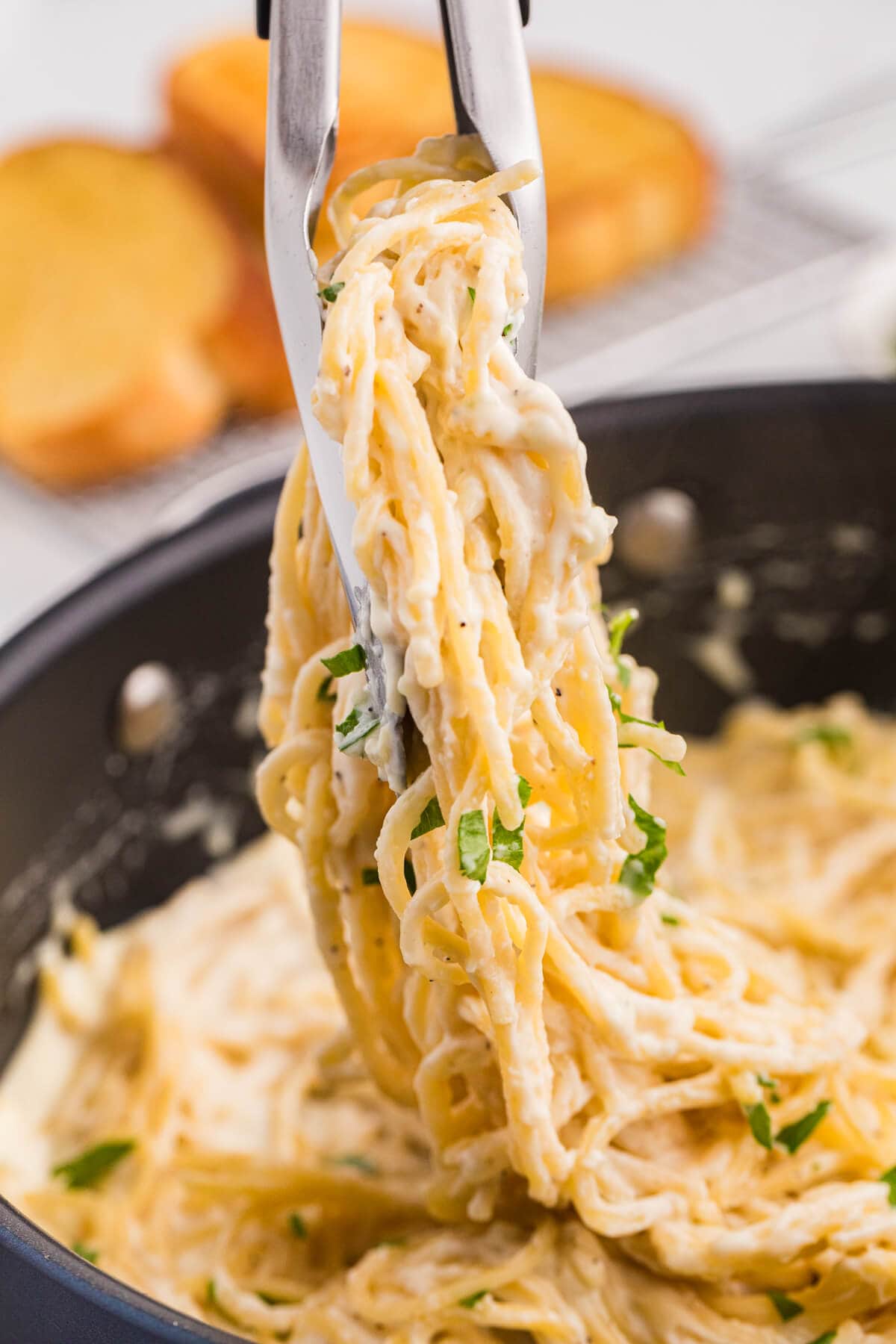 The recipe lifted from a skillet with tongs.