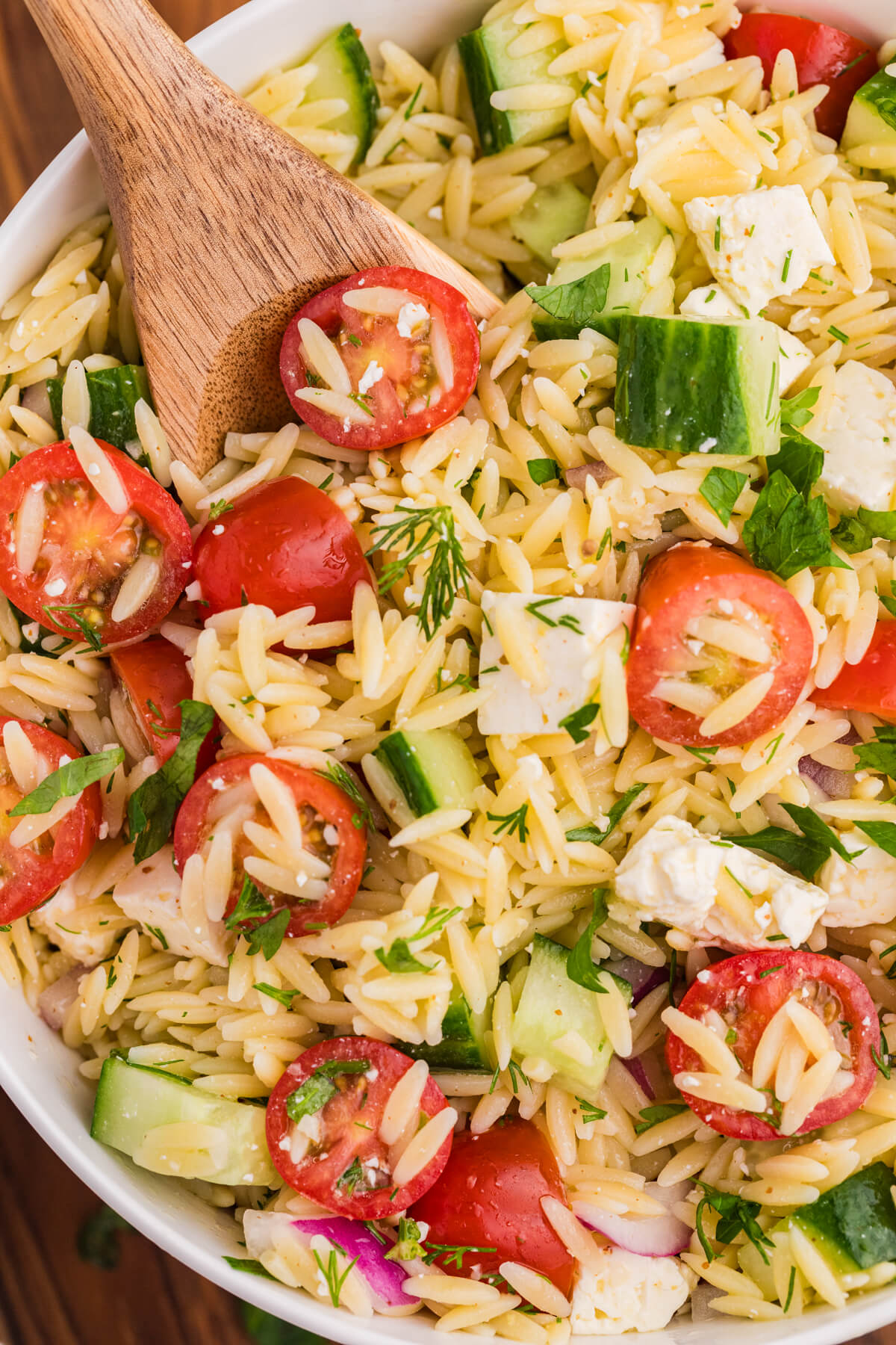 The recipe in a bowl with a wooden serving spoon.