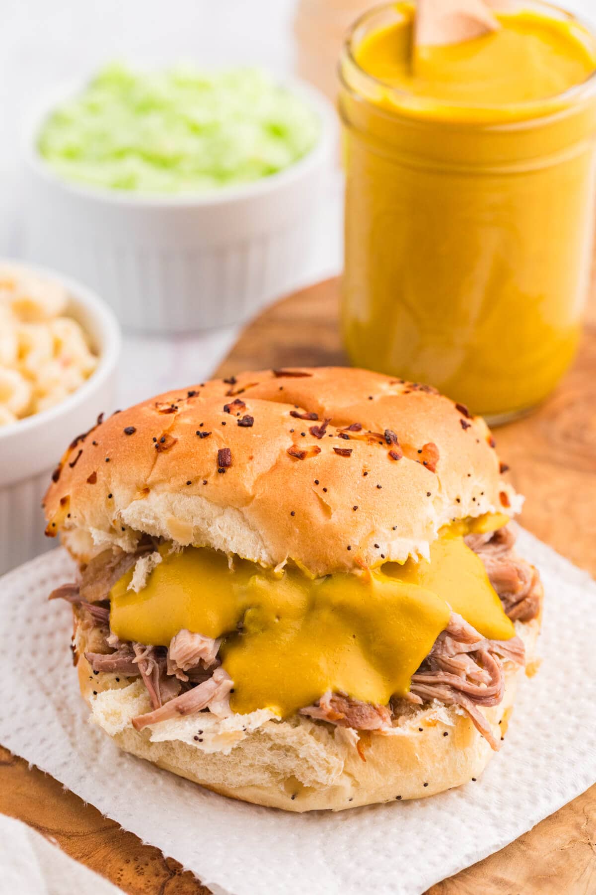 The sauce slatered on a bun with pulled pork.