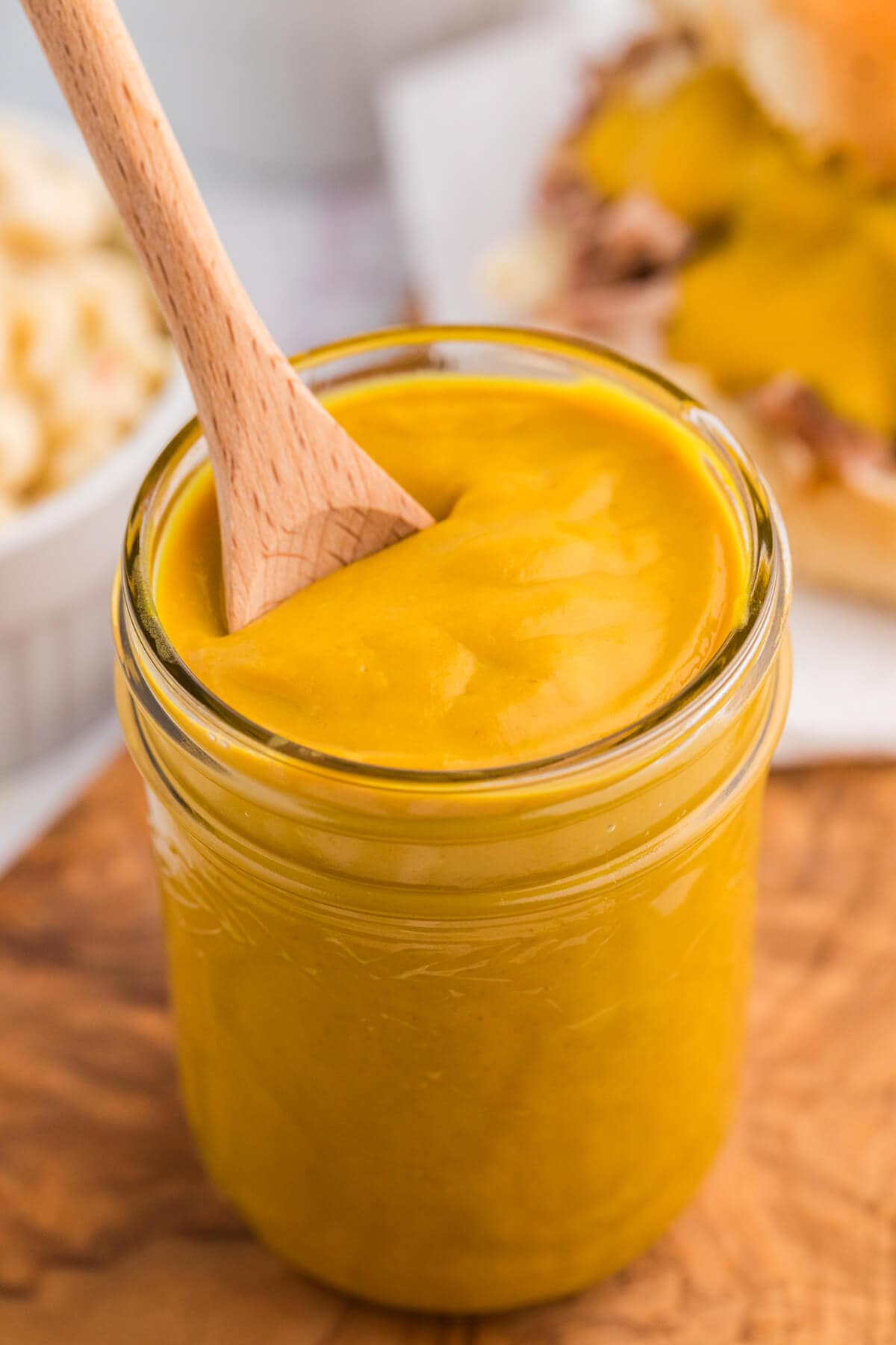 The recipe in a glass jar with a wooden spoon.