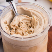 The recipe in a pint jar with a ice cream scoop in it.