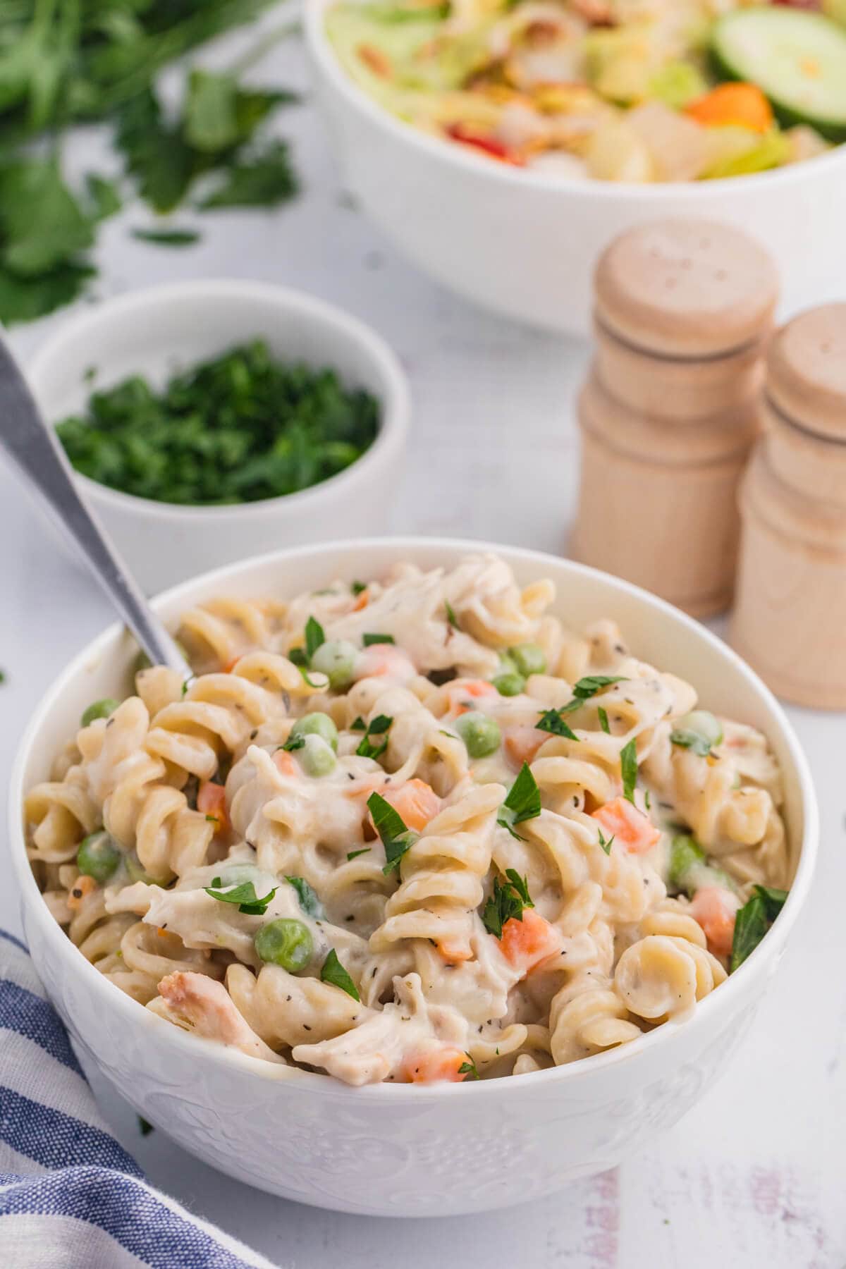 The recipe in a white bowl with a spoon.