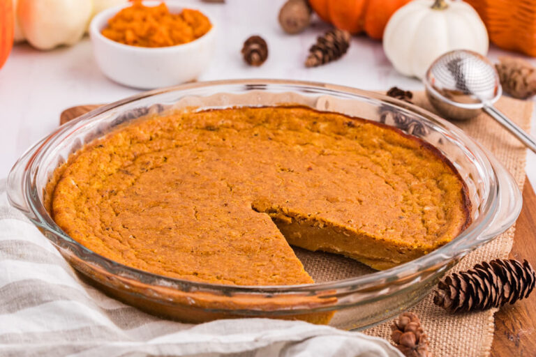The pie in a pan with a slice cut out.