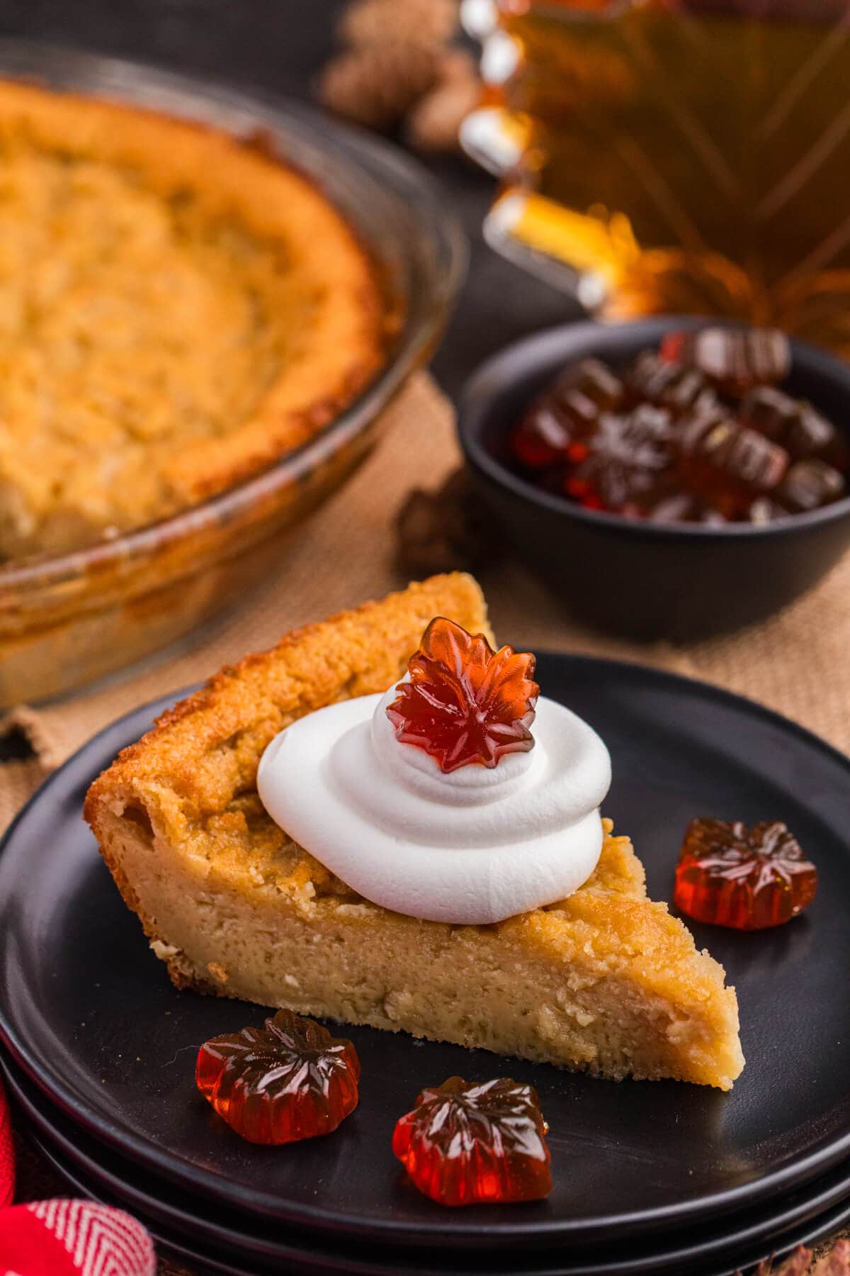 A slice of maple impossible pie on a plate.