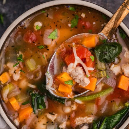 A bowl of the recipe with a spoon in it.