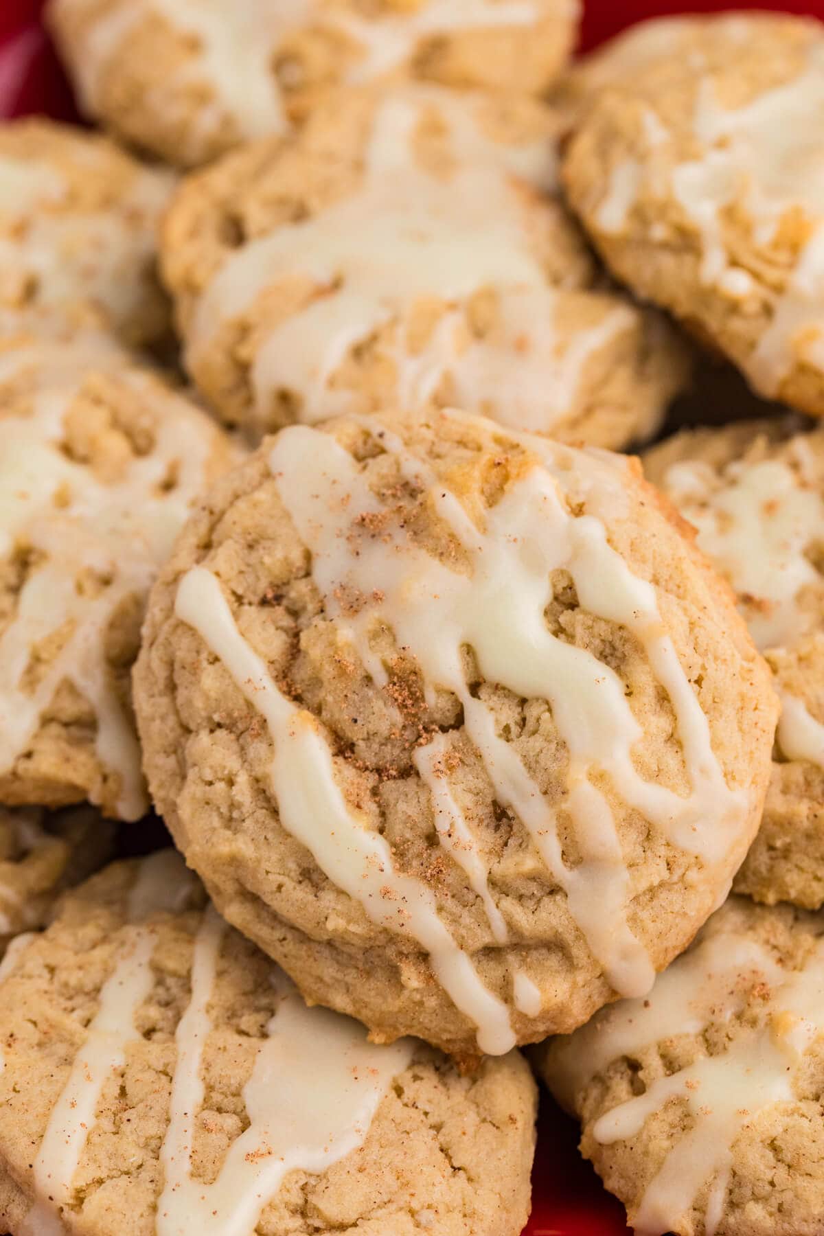 A vibrant red plate displaying a selection of freshly baked cookies.