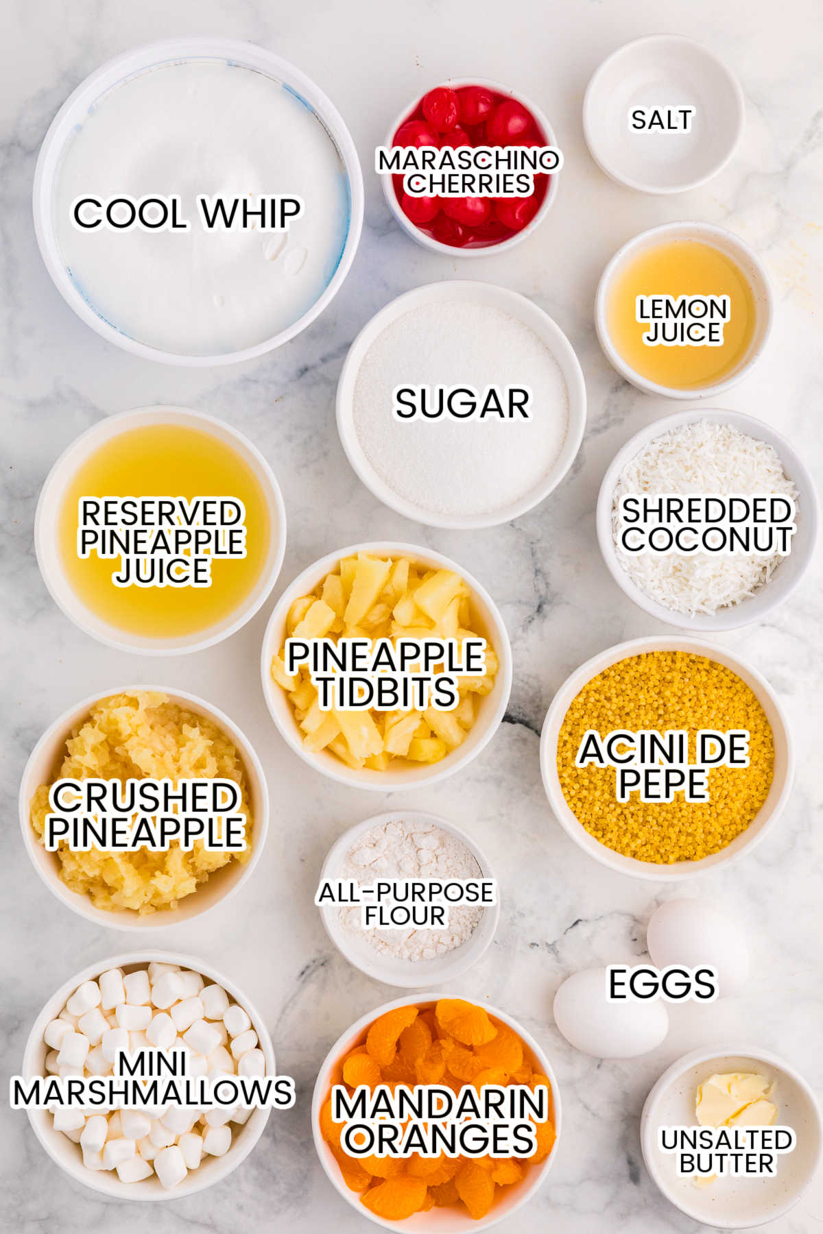 Ingredients on a white marble background.