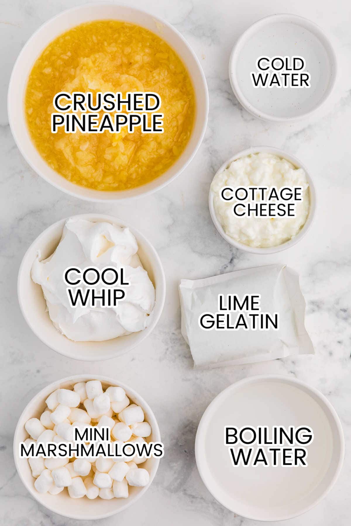 Ingredients in bowls on a marble background.