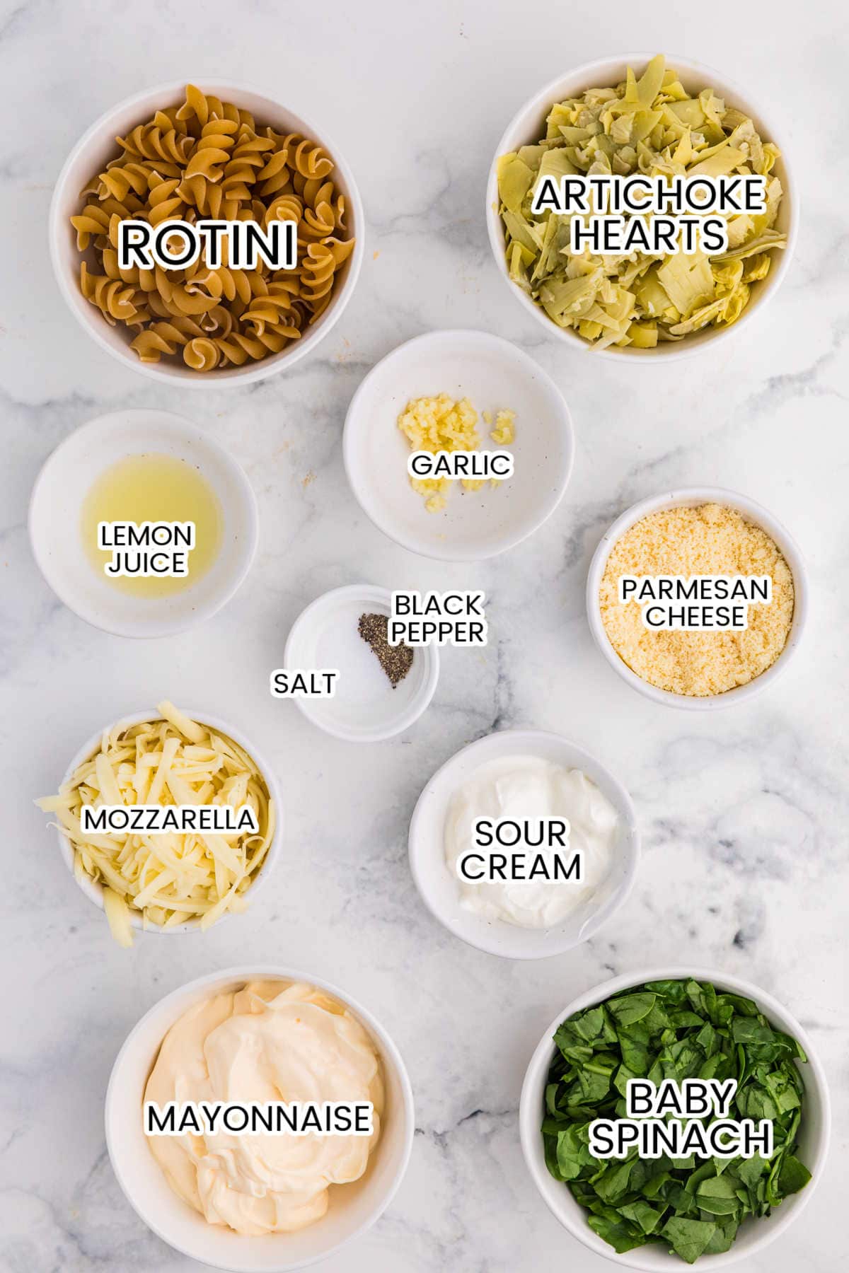 Ingredients on a white marble counter.