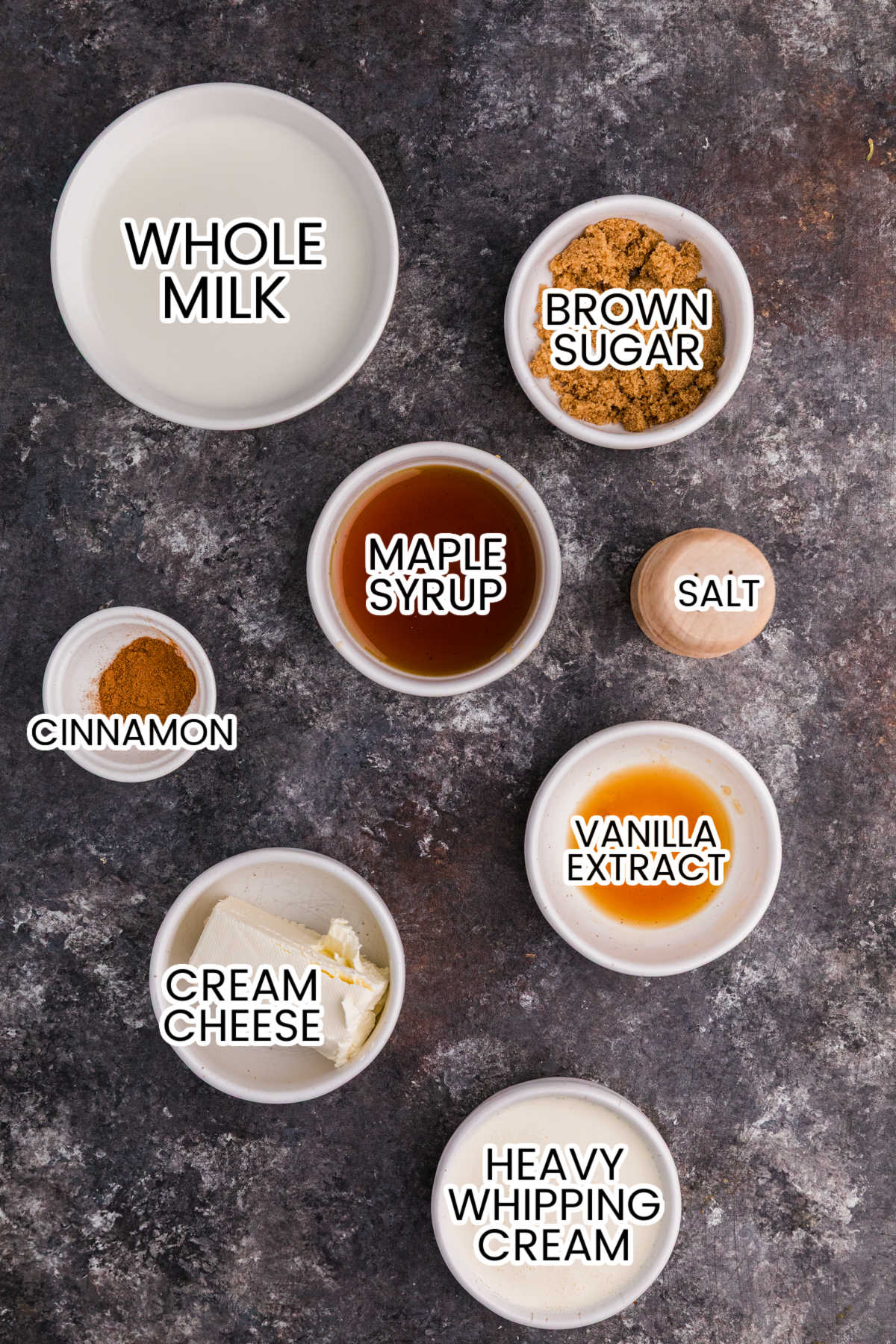 Ingredients for cinnamon roll ice cream: whole milk, heavy whipping cream, cream cheese, maple syrup, brown sugar, cinnamon, vanilla, and salt.