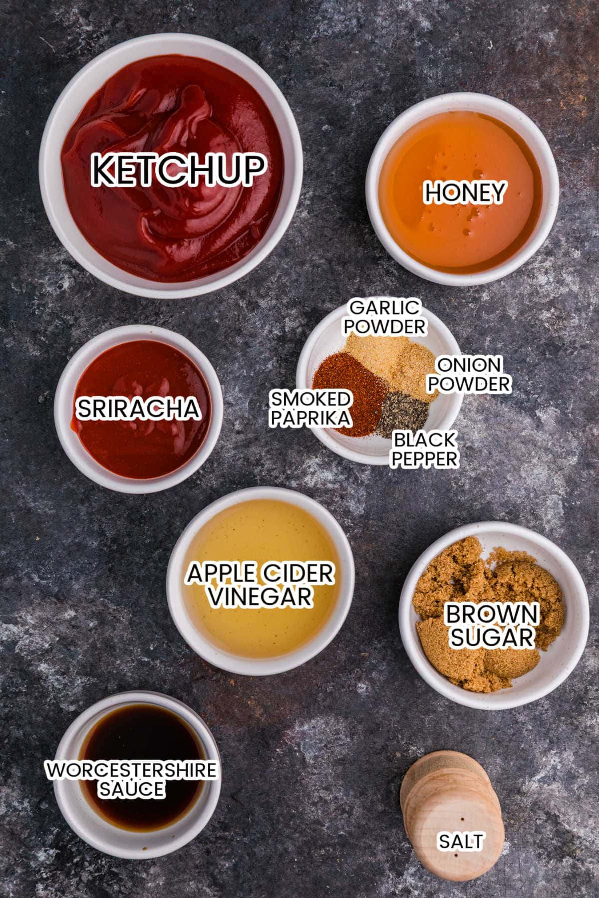 Ingredients for Honey Sriracha BBQ Sauce including ketchup, honey, Sriracha, apple cider vinegar, brown sugar, Worcestershire sauce, spices, and salt.